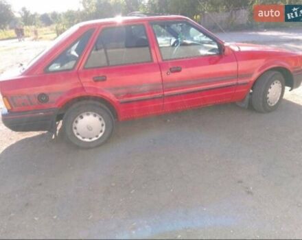 Красный Форд Эскорт, объемом двигателя 1.3 л и пробегом 904 тыс. км за 1100 $, фото 1 на Automoto.ua