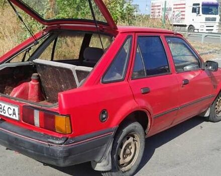 Красный Форд Эскорт, объемом двигателя 1.4 л и пробегом 150 тыс. км за 1200 $, фото 1 на Automoto.ua