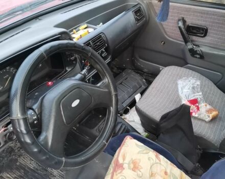 Красный Форд Эскорт, объемом двигателя 1.4 л и пробегом 300 тыс. км за 650 $, фото 4 на Automoto.ua