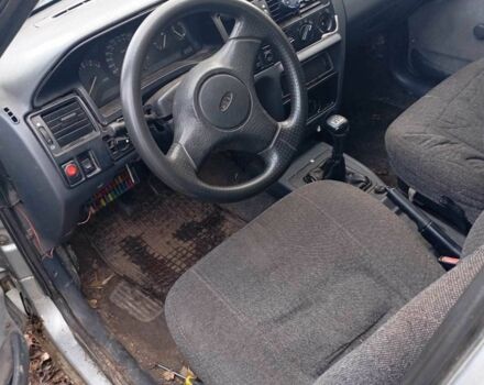 Серый Форд Эскорт, объемом двигателя 1.4 л и пробегом 200 тыс. км за 804 $, фото 6 на Automoto.ua