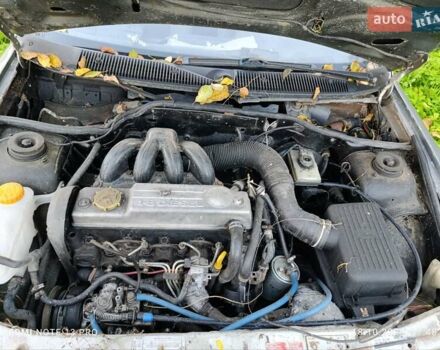 Серый Форд Эскорт, объемом двигателя 1.8 л и пробегом 320 тыс. км за 850 $, фото 2 на Automoto.ua