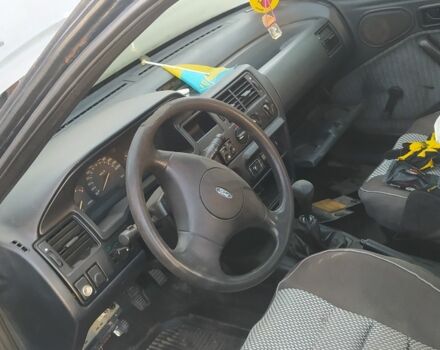 Серый Форд Эскорт, объемом двигателя 1.4 л и пробегом 300 тыс. км за 358 $, фото 3 на Automoto.ua