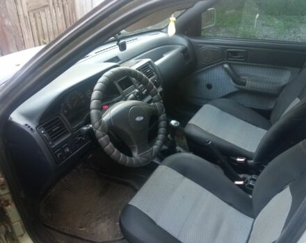 Серый Форд Эскорт, объемом двигателя 1.4 л и пробегом 300 тыс. км за 712 $, фото 7 на Automoto.ua