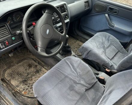 Серый Форд Эскорт, объемом двигателя 1.3 л и пробегом 67 тыс. км за 350 $, фото 10 на Automoto.ua