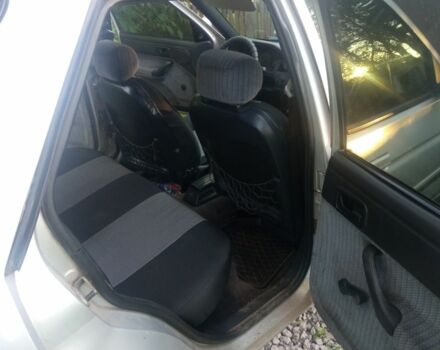 Серый Форд Эскорт, объемом двигателя 1.4 л и пробегом 300 тыс. км за 712 $, фото 9 на Automoto.ua