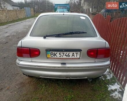 Серый Форд Эскорт, объемом двигателя 1.39 л и пробегом 300 тыс. км за 700 $, фото 1 на Automoto.ua