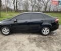 Черный Форд Фиеста, объемом двигателя 1.6 л и пробегом 230 тыс. км за 7800 $, фото 1 на Automoto.ua