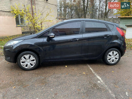 Черный Форд Фиеста, объемом двигателя 1.25 л и пробегом 180 тыс. км за 6700 $, фото 1 на Automoto.ua