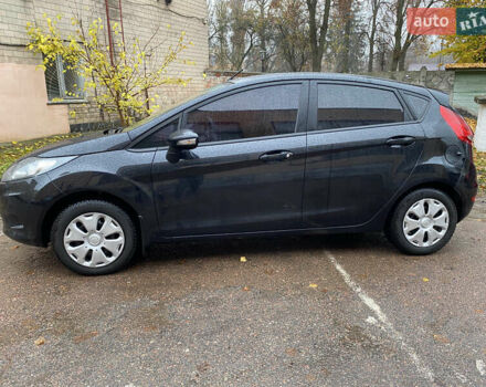 Черный Форд Фиеста, объемом двигателя 1.25 л и пробегом 180 тыс. км за 6700 $, фото 1 на Automoto.ua