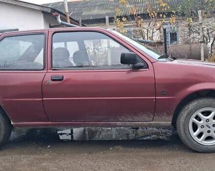 Красный Форд Фиеста, объемом двигателя 1.12 л и пробегом 100 тыс. км за 1066 $, фото 2 на Automoto.ua