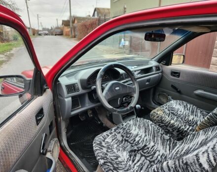 Красный Форд Фиеста, объемом двигателя 1.1 л и пробегом 345 тыс. км за 650 $, фото 6 на Automoto.ua