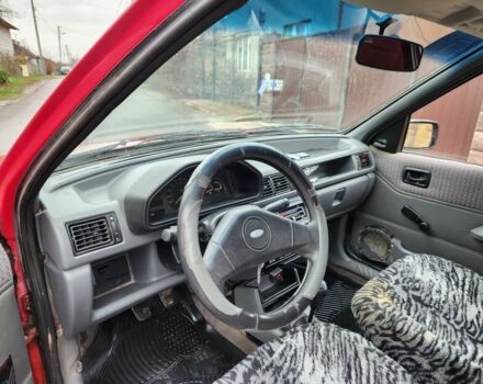 Красный Форд Фиеста, объемом двигателя 1.1 л и пробегом 345 тыс. км за 650 $, фото 7 на Automoto.ua