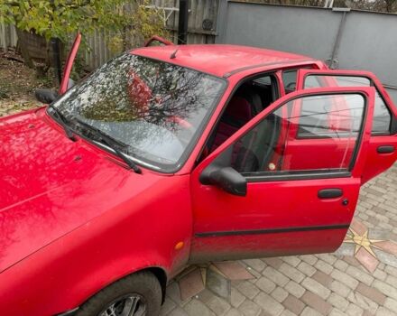 Красный Форд Фиеста, объемом двигателя 1.3 л и пробегом 200 тыс. км за 2200 $, фото 5 на Automoto.ua