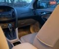 Белый Форд Фокус, объемом двигателя 2 л и пробегом 198 тыс. км за 8800 $, фото 11 на Automoto.ua
