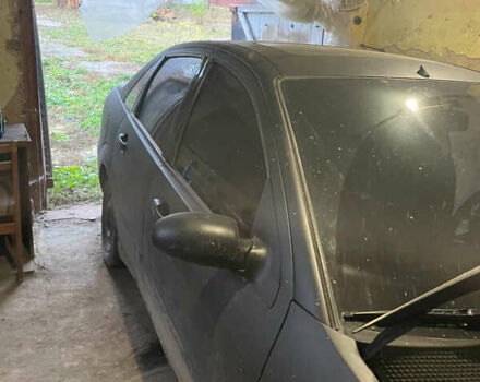 Черный Форд Фокус, объемом двигателя 1.8 л и пробегом 300 тыс. км за 600 $, фото 14 на Automoto.ua