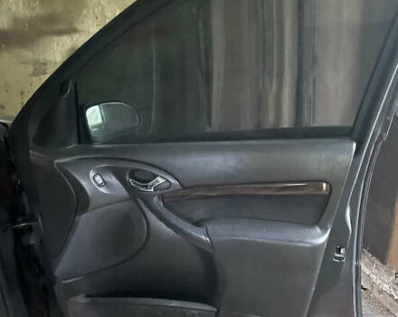 Черный Форд Фокус, объемом двигателя 1.8 л и пробегом 300 тыс. км за 600 $, фото 1 на Automoto.ua