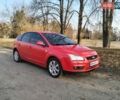Красный Форд Фокус, объемом двигателя 1.8 л и пробегом 232 тыс. км за 4500 $, фото 1 на Automoto.ua
