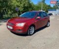 Красный Форд Фокус, объемом двигателя 1.6 л и пробегом 251 тыс. км за 3950 $, фото 1 на Automoto.ua