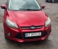 Червоний Форд Фокус, об'ємом двигуна 2 л та пробігом 138 тис. км за 6700 $, фото 1 на Automoto.ua
