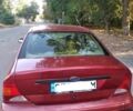 Красный Форд Фокус, объемом двигателя 2 л и пробегом 260 тыс. км за 3100 $, фото 1 на Automoto.ua