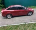 Красный Форд Фокус, объемом двигателя 2 л и пробегом 90 тыс. км за 8600 $, фото 1 на Automoto.ua