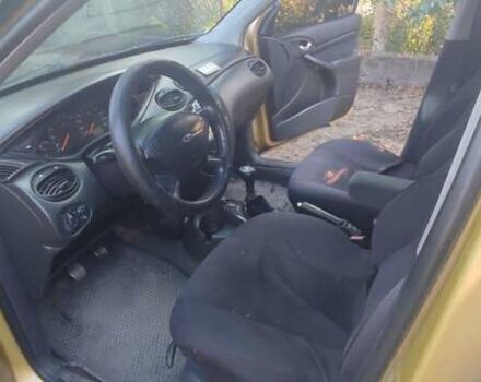 Желтый Форд Фокус, объемом двигателя 1.8 л и пробегом 325 тыс. км за 1900 $, фото 14 на Automoto.ua