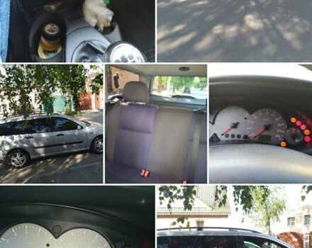 Серый Форд Фокус, объемом двигателя 1.8 л и пробегом 178 тыс. км за 3300 $, фото 12 на Automoto.ua