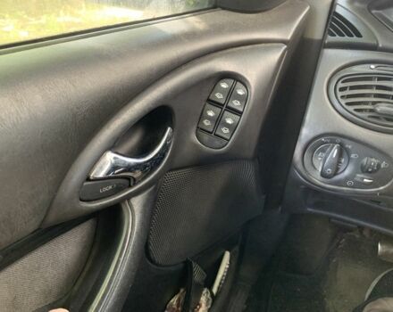 Серый Форд Фокус, объемом двигателя 1.8 л и пробегом 300 тыс. км за 3255 $, фото 5 на Automoto.ua