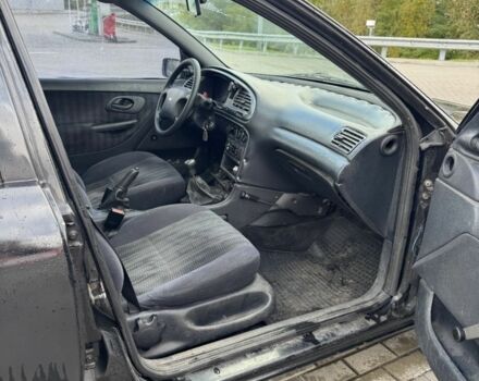 Черный Форд Мондео, объемом двигателя 1.8 л и пробегом 250 тыс. км за 1400 $, фото 12 на Automoto.ua