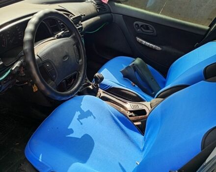 Красный Форд Мондео, объемом двигателя 1.8 л и пробегом 376 тыс. км за 1200 $, фото 3 на Automoto.ua