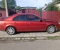 Червоний Форд Мондео, об'ємом двигуна 2 л та пробігом 300 тис. км за 4400 $, фото 1 на Automoto.ua
