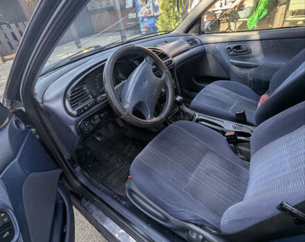 Синий Форд Мондео, объемом двигателя 1.8 л и пробегом 314 тыс. км за 1400 $, фото 1 на Automoto.ua