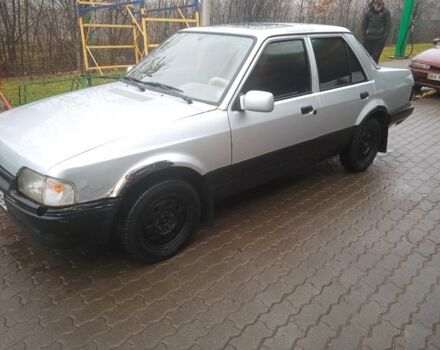 Серый Форд Орион, объемом двигателя 0 л и пробегом 200 тыс. км за 450 $, фото 1 на Automoto.ua