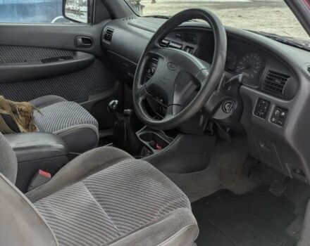 Красный Форд Рейнджер, объемом двигателя 2.5 л и пробегом 210 тыс. км за 4627 $, фото 6 на Automoto.ua