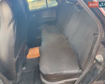 Черный ГАЗ 31105 Волга, объемом двигателя 2.3 л и пробегом 370 тыс. км за 2000 $, фото 1 на Automoto.ua