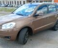 Коричневий Джилі Емгранд, об'ємом двигуна 2 л та пробігом 157 тис. км за 4800 $, фото 1 на Automoto.ua