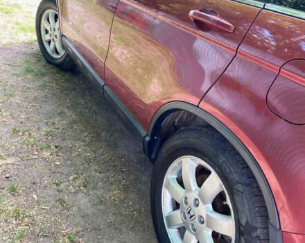 Красный Хонда СРВ, объемом двигателя 2.35 л и пробегом 150 тыс. км за 10000 $, фото 2 на Automoto.ua