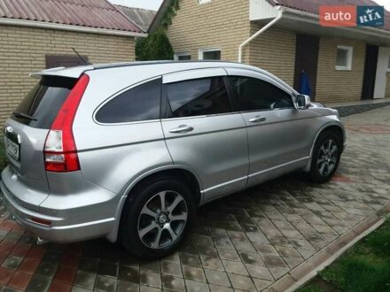 Серый Хонда СРВ, объемом двигателя 2.4 л и пробегом 145 тыс. км за 16000 $, фото 1 на Automoto.ua