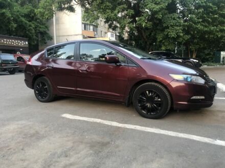 Красный Хонда Инсайт, объемом двигателя 1.3 л и пробегом 208 тыс. км за 4300 $, фото 1 на Automoto.ua