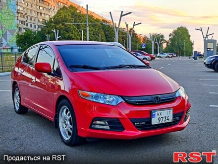Красный Хонда Инсайт, объемом двигателя 1.3 л и пробегом 250 тыс. км за 9000 $, фото 1 на Automoto.ua