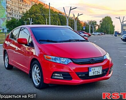 Красный Хонда Инсайт, объемом двигателя 1.3 л и пробегом 250 тыс. км за 9000 $, фото 1 на Automoto.ua