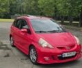 Красный Хонда Джаз, объемом двигателя 1.34 л и пробегом 235 тыс. км за 3800 $, фото 1 на Automoto.ua
