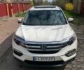 Белый Хонда Пилот, объемом двигателя 3.47 л и пробегом 106 тыс. км за 21000 $, фото 1 на Automoto.ua