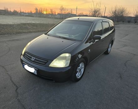 Чорний Хонда Стрім, об'ємом двигуна 2 л та пробігом 216 тис. км за 5600 $, фото 1 на Automoto.ua