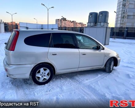 Желтый Хонда Стрим, объемом двигателя 2 л и пробегом 321 тыс. км за 3600 $, фото 1 на Automoto.ua