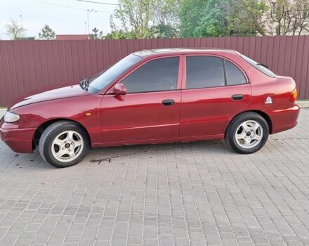 Красный Хендай Акцент, объемом двигателя 1.5 л и пробегом 150 тыс. км за 2700 $, фото 2 на Automoto.ua