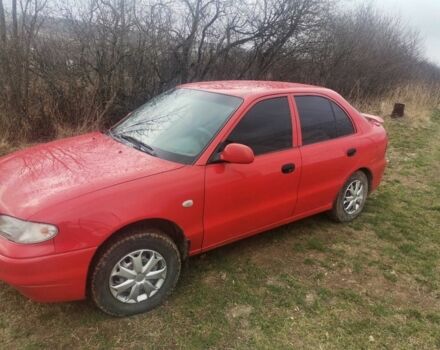 Красный Хендай Акцент, объемом двигателя 1.5 л и пробегом 230 тыс. км за 2079 $, фото 3 на Automoto.ua