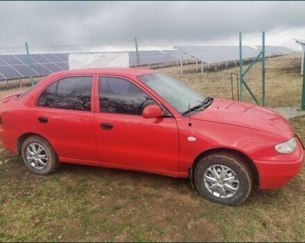 Красный Хендай Акцент, объемом двигателя 1.5 л и пробегом 230 тыс. км за 2079 $, фото 2 на Automoto.ua