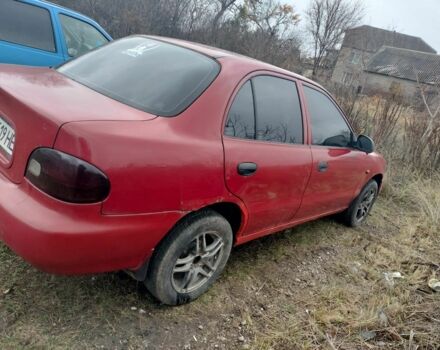 Красный Хендай Акцент, объемом двигателя 1.3 л и пробегом 470 тыс. км за 650 $, фото 5 на Automoto.ua