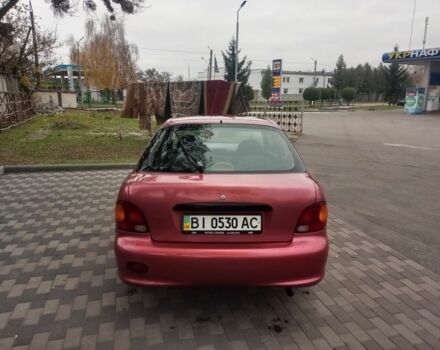 Червоний Хендай Акцент, об'ємом двигуна 1.4 л та пробігом 200 тис. км за 1250 $, фото 3 на Automoto.ua